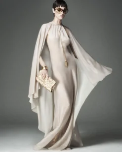 EVENING DRESS WITH KEYHOLE NECKLINE AND ASYMMETRIC CAPE